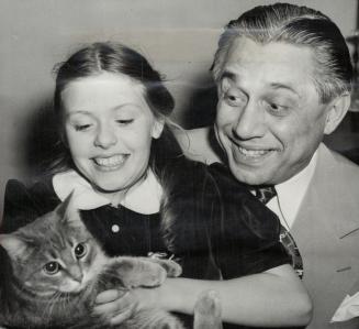 None of that crazy stuff. says Joy Olsen. 10, daughter of Wacky Ole, as she plans her stage career. Here her father forgets comedy to cuddle his daughter and her cat