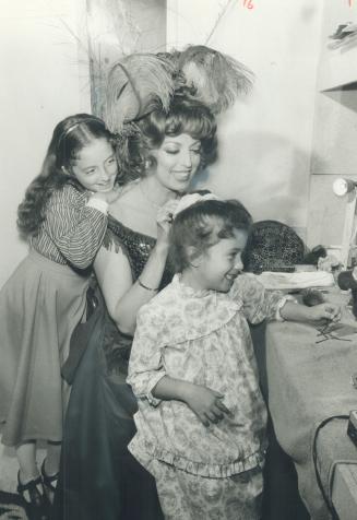 My mother the star, Sandra O'Neill's two daughters, Aileen, 10, left, and Alexandra, 5, seated at the dressing table, visit with her after a rehearsal(...)