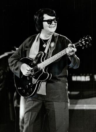 Historic photo from Tuesday, May 17, 1983 - Roy Orbison brought warmth to the hearts if not the feet of fans who braved the unseasonbly frigid air at Ontario Place in Ontario Place