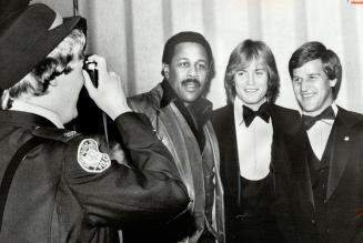 Some line-up, Police Constable Alice Littleford snaps at Willie Stargell, left, Pat Hickey and Bobby Orr prior to Sports Celebrities Dinner last night(...)