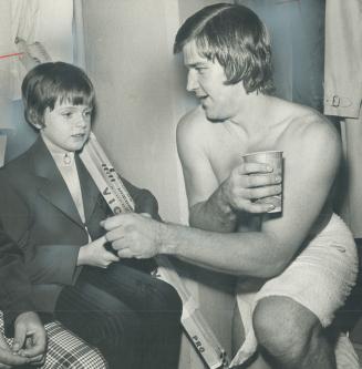 Ten-year-old Frank Fitzgerald of Preston, who is going blind with an incurable eye disease, talks with his idol Bobby Orr in the dressing room after t(...)