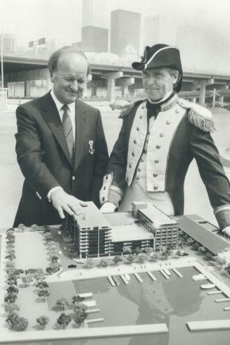 What a parking lot! Walter Oster (left), one of the owners of the proposed new Admiral Hotel and Admiralty Point condominiums, and costumed Ernie Ryle(...)