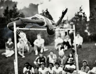 Up and over, Toronto high jumper Milt Ottey has perfect form as he clears 2