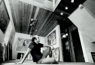 Studio ceiling in cedar, Pachter relaxes among his art in his second floor studio
