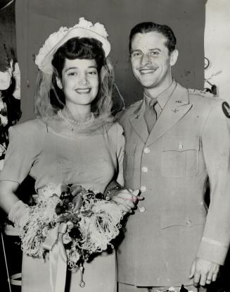 Film Actress Joy Ann Page, 20, is shown with Lieut William Orr, 27, just after their marriage in Riverside, Cal