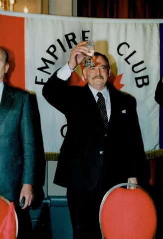 Parti Quebecois leader Jacques Parizeau toasts the Queen with glass of water at Toronto's Empire club