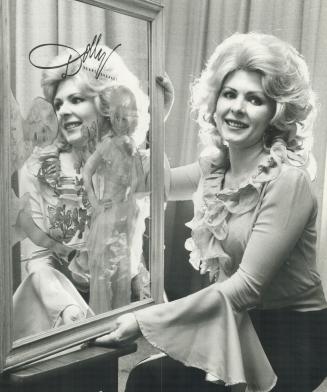 Hello Dolly?, Angie Huntley, 33, of Keswick, a former country-and-western singer, won the Dolly Parton look-alike contest at Exhibition Place yesterday