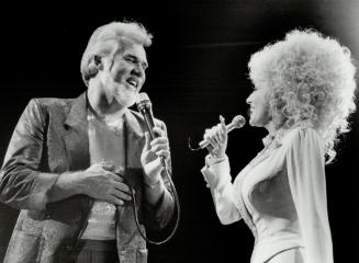 Well, hello Dolly Parton!, . . . it was so nice to have you back in town with Kenny Rogers at Maple Leaf Gardens last night, where 15,000 country musi(...)