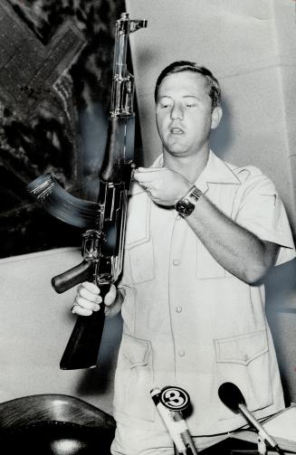 Capt. Ian Patten, 28, of Etobicoke, holds a Chinese-made automatic rifle and describes his 17 days as a prisoner of the Viet Cong. [Incomplete]