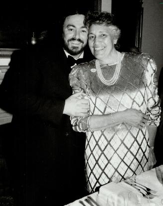 Meeting a star, Luciano Pavarotti thanks the banquet's organizer, Georgina Madott