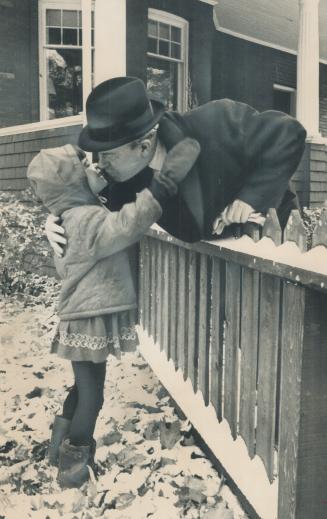 A kiss for Granddad is given Prime Minister Pearson by his granddaughter, Robin Hannah, The girl had already left her Warren Rd. home for school when (...)