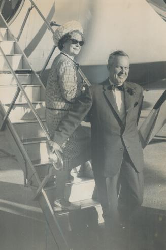 Prime Minister Lester Pearson and his wife arriving in Toronto from Gore Bay last night