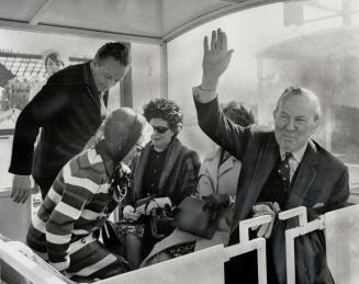 Beaming. Prime Minister Lester Pearson, obviously elated with the success of Expo, takes a ride on the fair's mini-rail. He said his earlier doubts ab(...)