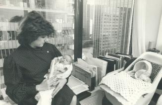 Working mother, Metro Police Commissioner Jane Pepino takes her 3-week-old daughter, Victoria Jane, to work with her, as she did with her other childr(...)