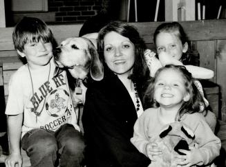 Lawyer Jane Pepino with Drew, 7, left, Blaine, 6, Tory, 3, and family dog, Sun