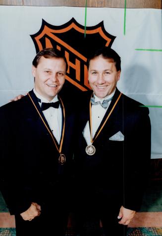 Hall of famers, Bill Barber, left, and Gil Perreault enter Hockey Hall of Fame