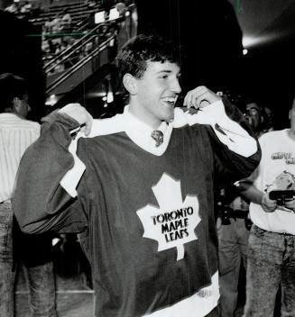 The simplified maple leaf, the one worn by Leaf draft pick Yanic Perreault at the NHL draft in Buffalo (left) on Saturday, was introduced by late team owner Harold Ballard in the '70s