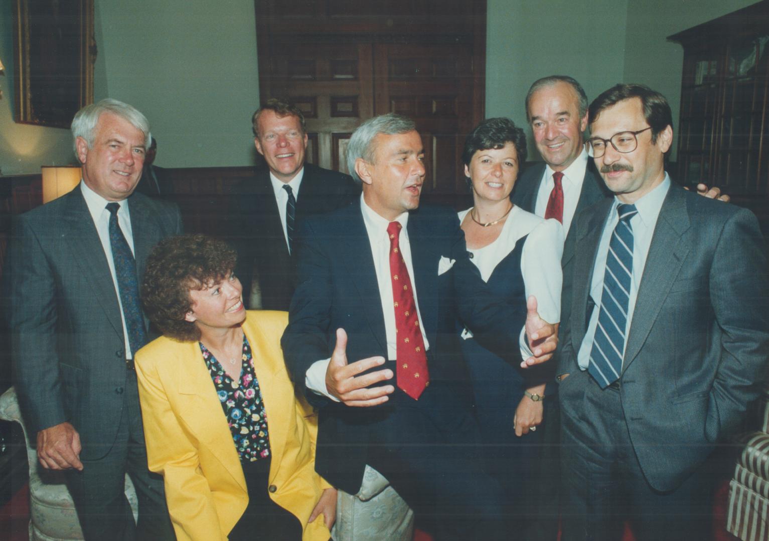 New faces, Premier David Peterson, centre, chats at Queen's Park yesterday with six new cabinet members, from left, Kenneth Black, Christine Hart, Cha(...)