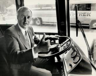 In the driver's seat, Premier David Peterson, leading in the polls and hoping to win government, takes a spin at the wheel of his campaign bus at Quee(...)