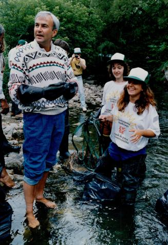 Premier David Peterson wades in the polluted waters of Taylor Creek with Environmental Youth Corps workers Joy Morris, 19, and Lisa Anderson, 18, yest(...)