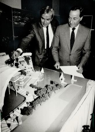 Ontario's place, Premier David Peterson and British Columbia Premier Bill Bennett study a model of Ontario's Expo 86 pavilion at Queen's Park yesterda(...)