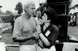 Together again, Premier David Peterson and MPP Chaviva Hosek meet at a Liberal picnic in the city o f York yesterday, two weeks after he dropped her as housing minister