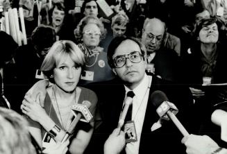 Tense moment, David Peterson and his wife, Shelley, share a tense moment as they watch the posting of results during yesterday's balloting for the Ont(...)