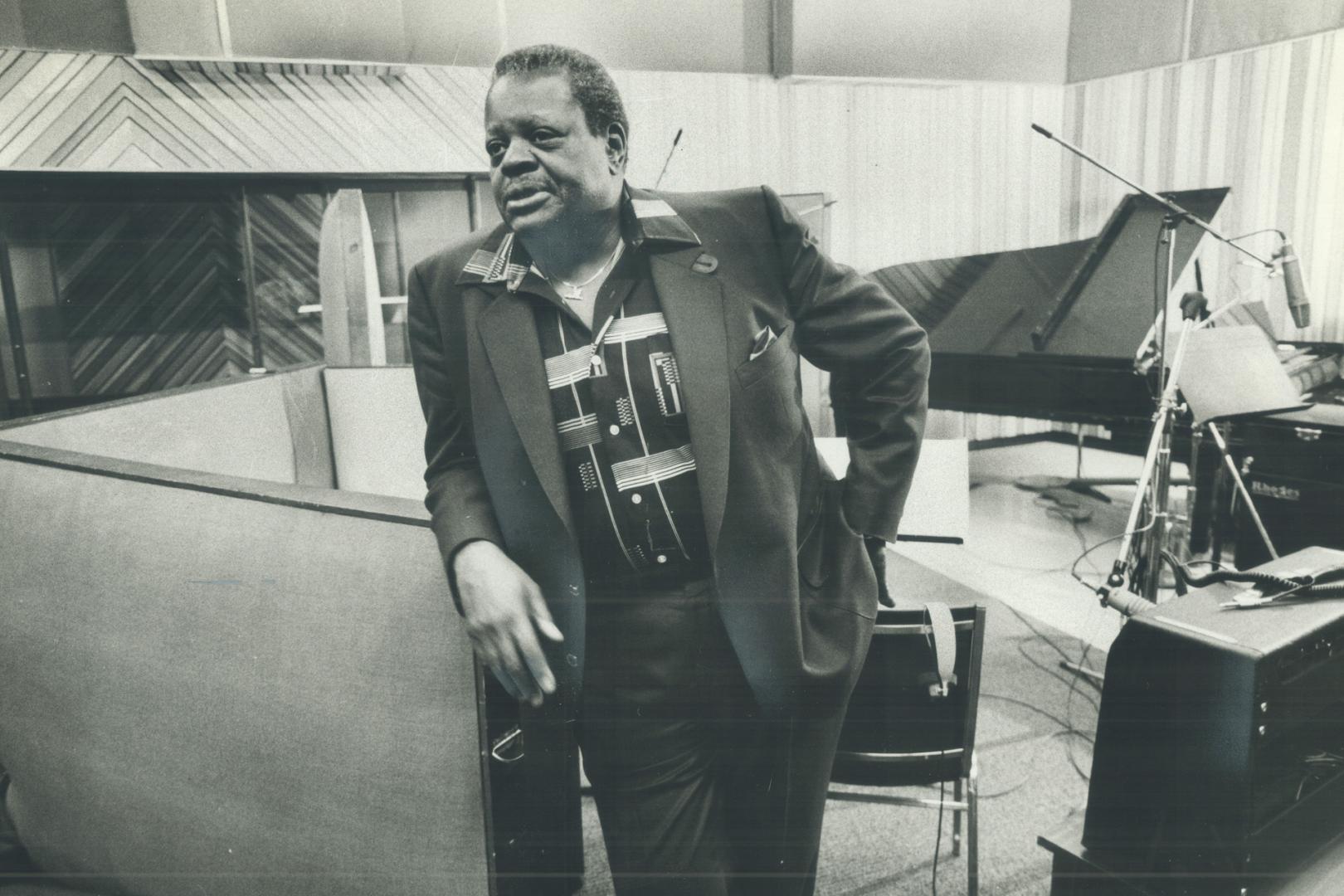 Taking five, Oscar Peterson, resting from a recording session, is soon to become more familiar to Canadians through bank commercials and an all-Canadian album