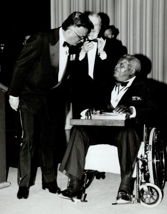 Peterson Honored. Governor-General Ray Hnatyshyn presents Jazz pianist Oscar Peterson with Glenn Gould Prize at CBC's Toronto centre last night