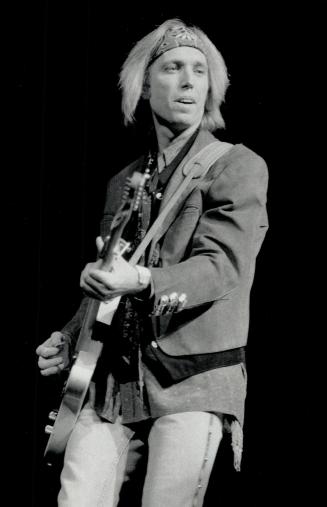 Tom Petty rocked the house with 'Learning to fly' then dipped back to 1978 for 'She Don't Need You' at concert in Maple Leaf Gardens Sunday night, reviewer Lenny Stoute reports