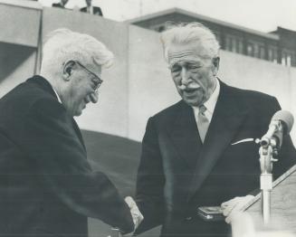 Mayor of all the people and champion of the new City Hall, Nathan Phillips is congratulated by Governor-General Vanier who presented him with gold civ(...)