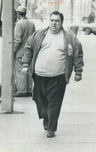 Taking his daily walk near St. Michael's Hospital Alderman Joseph Piccininni found his first few outings, when he still weighed 348 pounds, were exhausting