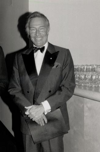 Below, actor Christopher Plummer looked tanned and happy at the Elgin openin in a double-breasted dinner jacket with his Order of Canada in the lapel