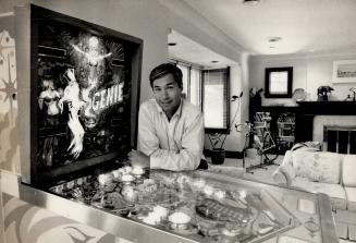 Pinball wizard, The biggest and most favored 'toy' in Steve Podborski's living room is a Genie pinball machine complete with music and flashing lights(...)