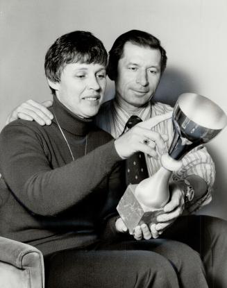 Jackie and Mike Podborski admire a downhill trophy which their son Steve won in Italy