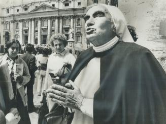 The face of grief, A nun offers prayers for the safe recovery of Pope John Paul II