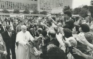 Reaching out, In his exhausting 12-day tour of Canada, Pope John Paul II drew ever-fresh energy from hundreds of thousands of outstretched arms and upturned faces