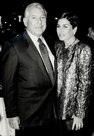 Above, Irving Posluns, executive vice-president of Dylex, and his wife Elissa, in Krizia's silver brocade jacket