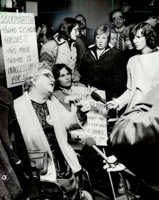 Wheelchair protest, Beryl Potter and Pat Israel (right) led a protest group of handicapped at the Plaza 2 Cinema at last night's premier of Whose Life(...)