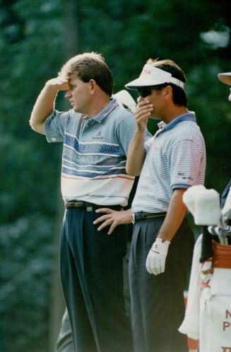 Opening stance. Nick Price, left, leading money winner on the U.S. golf tour, and top Canadian golfer Richard Zokol mull over their drives at Glen Abb(...)