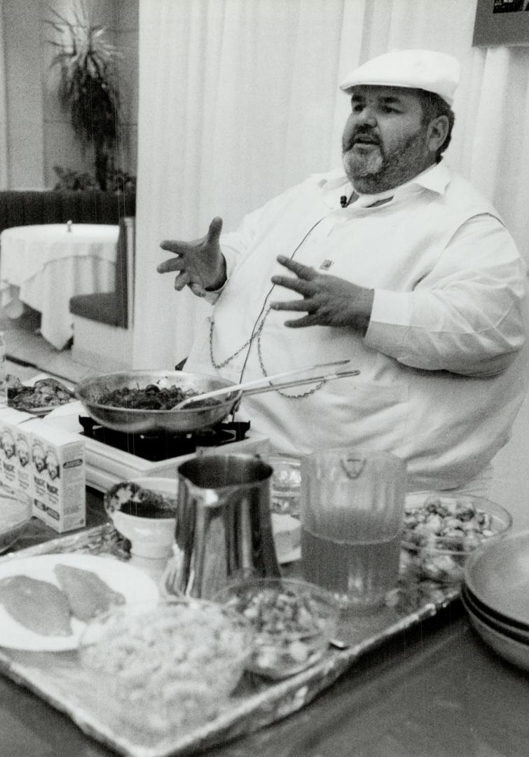 Southern hospitality, Louisiana chef Paul Prudhomme tickles the palates of shoppers (top) with spicy Chicken Marengo during a midday demonstration yesterday at The Bay's Arcadian Court