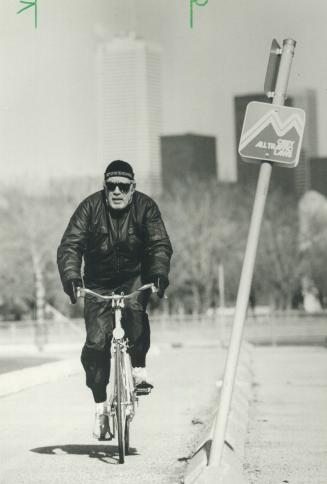 You're right, it's Zorba, Anthony Quinn, 69, on a break from the play Zorba at the O'Keefe Centre, takes a bicycle ride on the Martin Goodman Trail along Toronto's lakefront