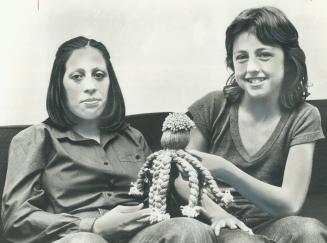 Vicki Nicholson (right) presents octopus to Leticia Quinones
