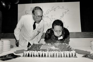 Just one puff, Herbie Quinones needs no help from Dr. Robert Filler to blow out candles at the Hospital For Sick Children. Filler performed the lifesaving operation on Herbie