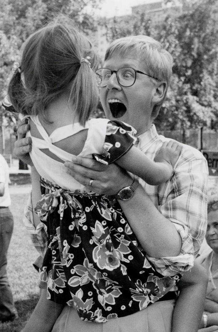 New Democrat leader Bob Rae gets a big hug from his daughter Eleanor, 5, at the Sundays for Families picnic at the Columbus Centre on Lawrence Ave