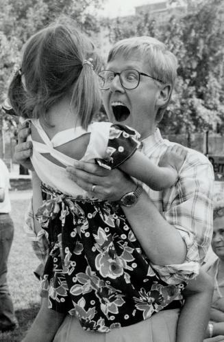 New Democrat leader Bob Rae gets a big hug from his daughter Eleanor, 5, at the Sundays for Families picnic at the Columbus Centre on Lawrence Ave