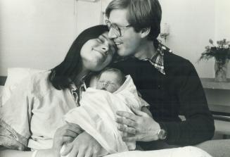 A little Rae, Ontario NDP Leader Bob Rae and his wife, Arlene, cuddle daughter, Lisa Ruth Perly, born early yesterday at Toronto General Hospital. She(...)