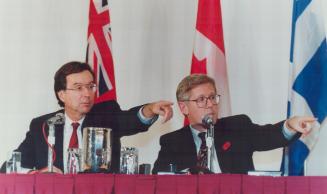 Premiers in sync, Quebec's Robrt Bourassa and Ontario's Bob Rae answer questions after their lunch yesterday