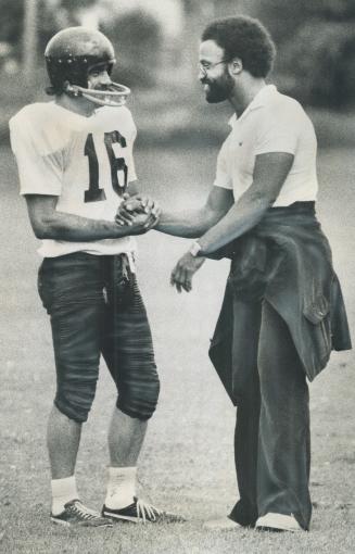 Dave Raimey (right) says goodbye to Billy Cooper before leaving Argo training camp in Aurora yesterday