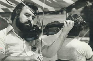Graham Townsend fiddled while fellow Mariposans did what came naturally